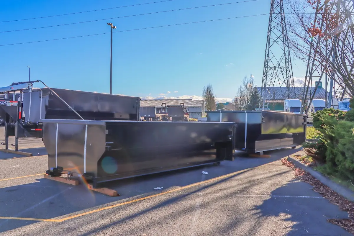 Roll-off dumpster ready for waste disposal at job site for Yard Waste Dumpster Rental in Earl
